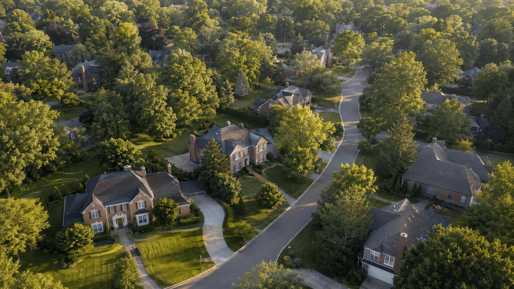 suburbs-of-detroit-aerial Aerial view of a tree-lined suburb of Detroit on a summer afternoon